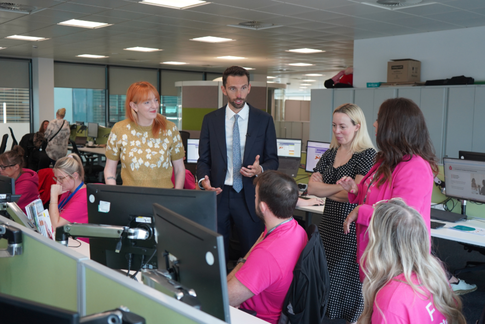 Childcare Minister Josh MacAlister speaks to staff at the Foster4 Recruitment Hub