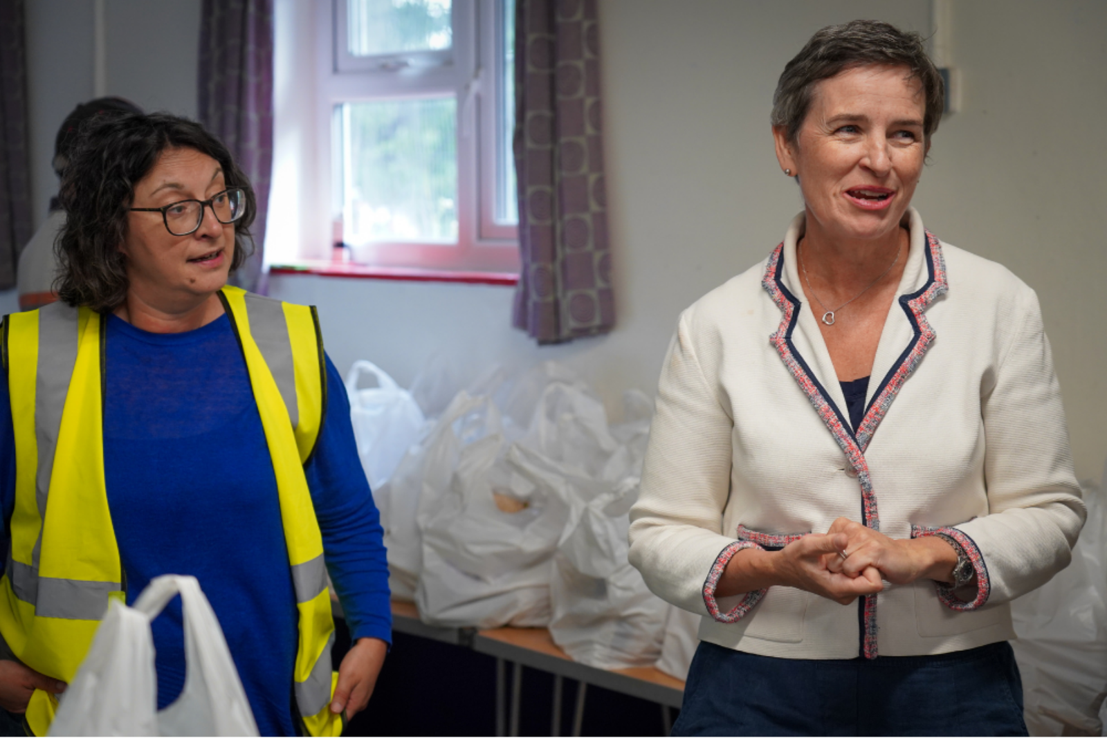Mary Creagh speaks with staff at the Bread and Butter Thing, a charity tackling poverty in the UK.